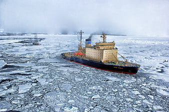 Icebreaker ship navigating through arctic sea ice