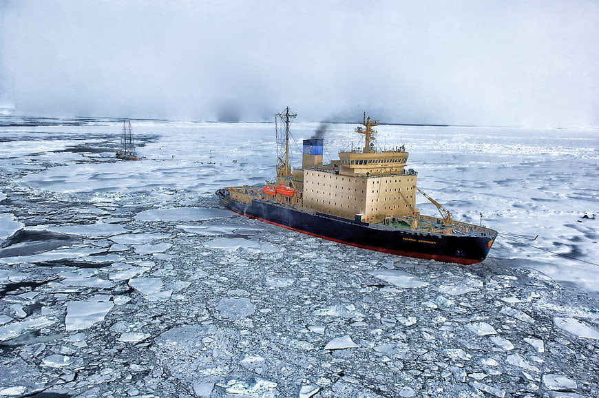 Icebreaker ship navigating through arctic sea ice