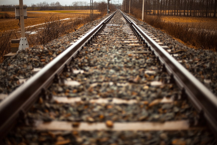 Low Angle View of Train Tracks Stretching into the Distance