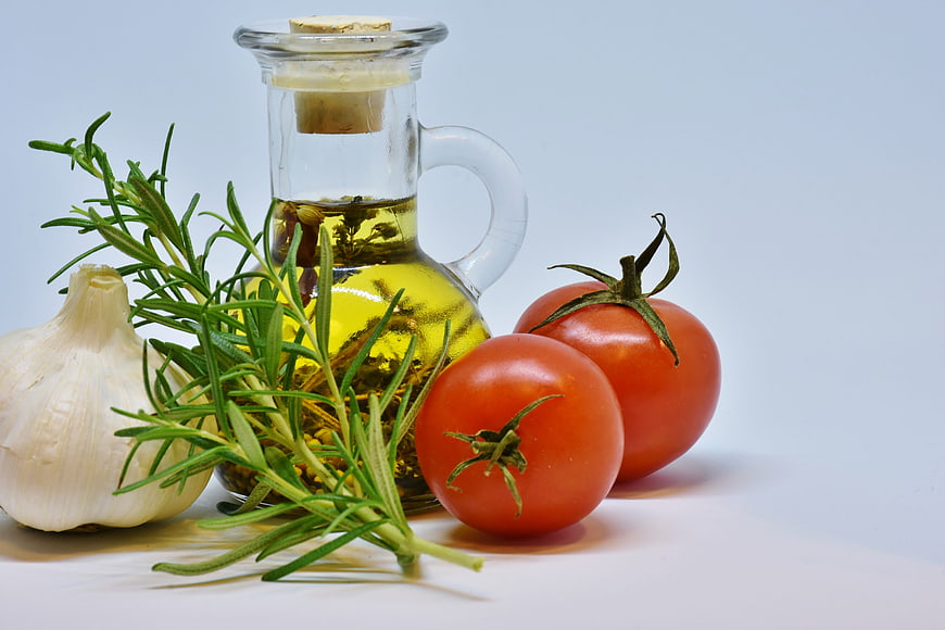 Fresh Mediterranean Cooking Ingredients with Olive Oil and Tomatoes