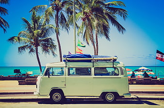 Vintage white van parked on tropical beach road