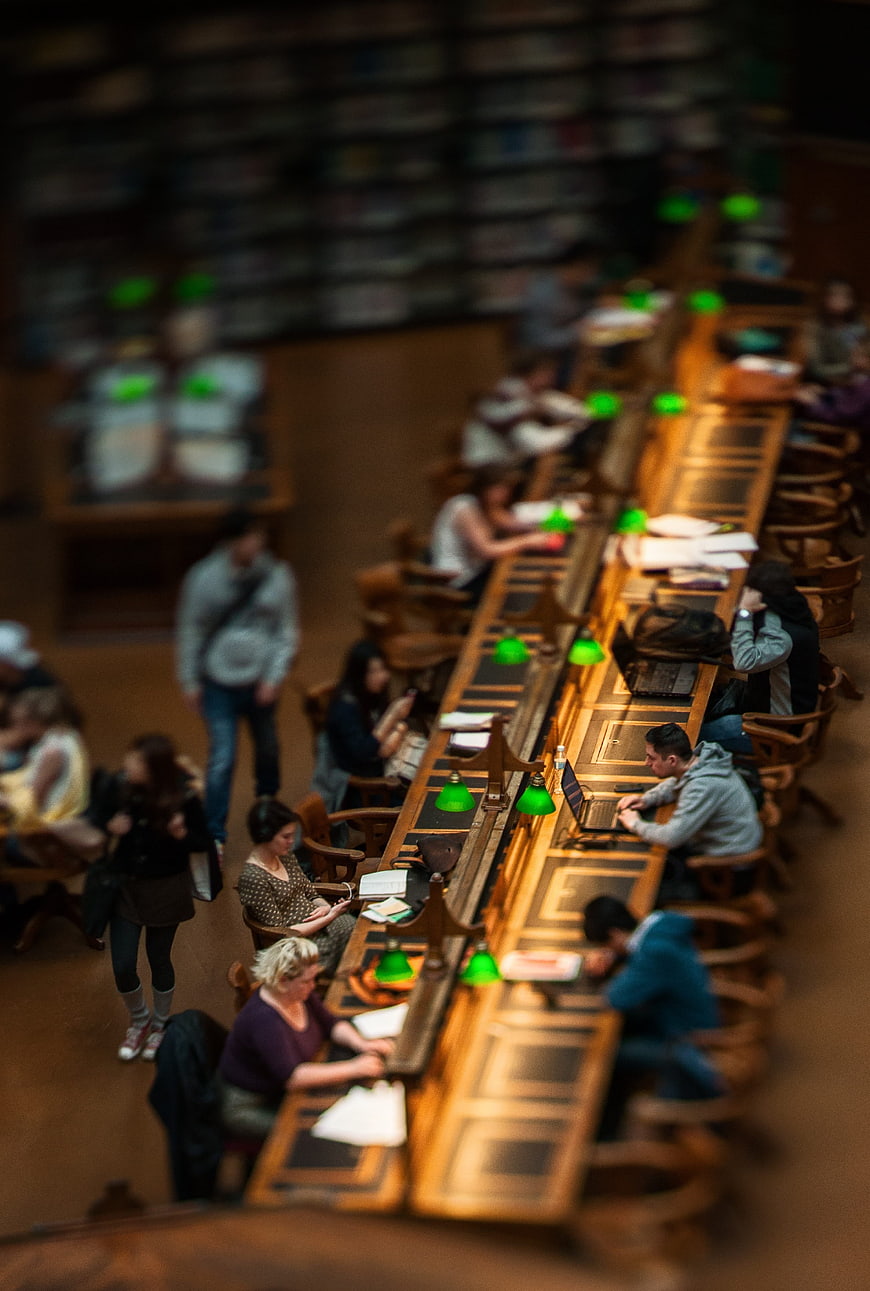 Tilt-shift view of students studying in a library