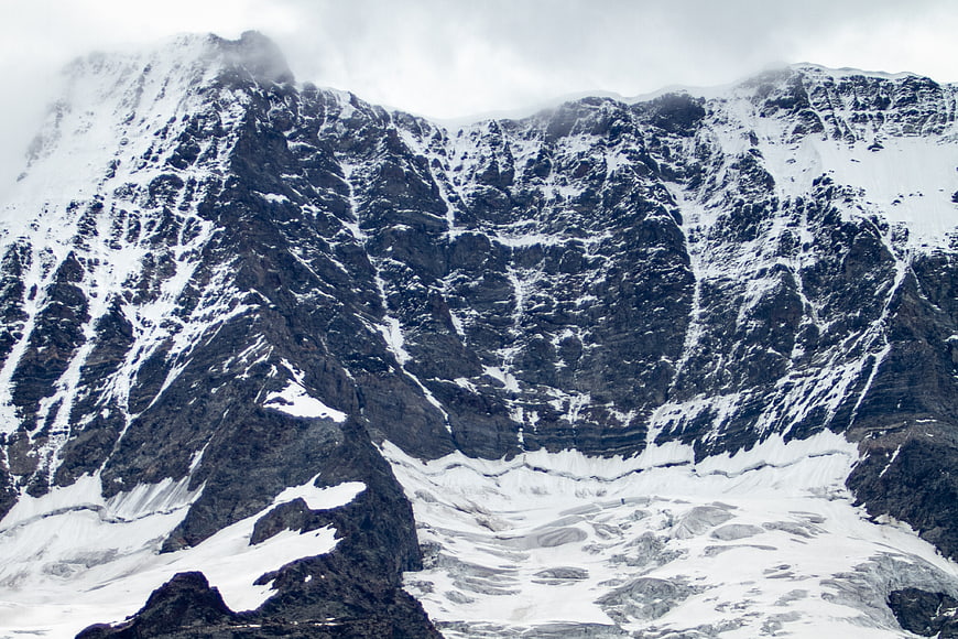 Majestic Snow-Capped Mountain Peak with Rocky Terrain