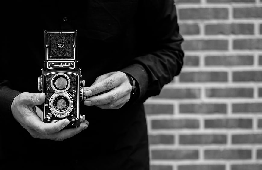 Hands Holding Vintage Rolleicord TLR Camera