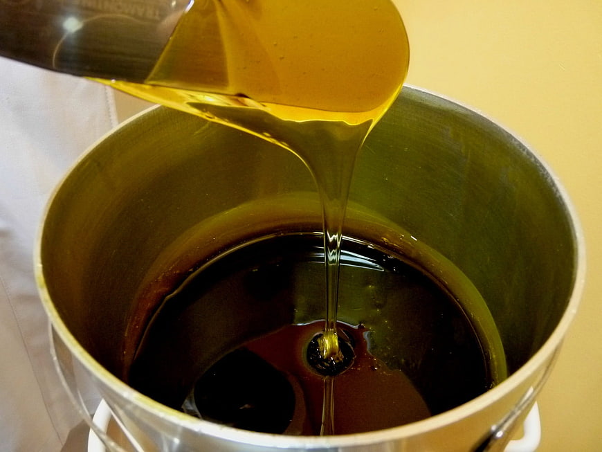 Golden Depilatory Wax Being Poured Into Metal Container