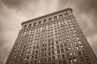 Low angle view of Flatiron Building in sepia tone