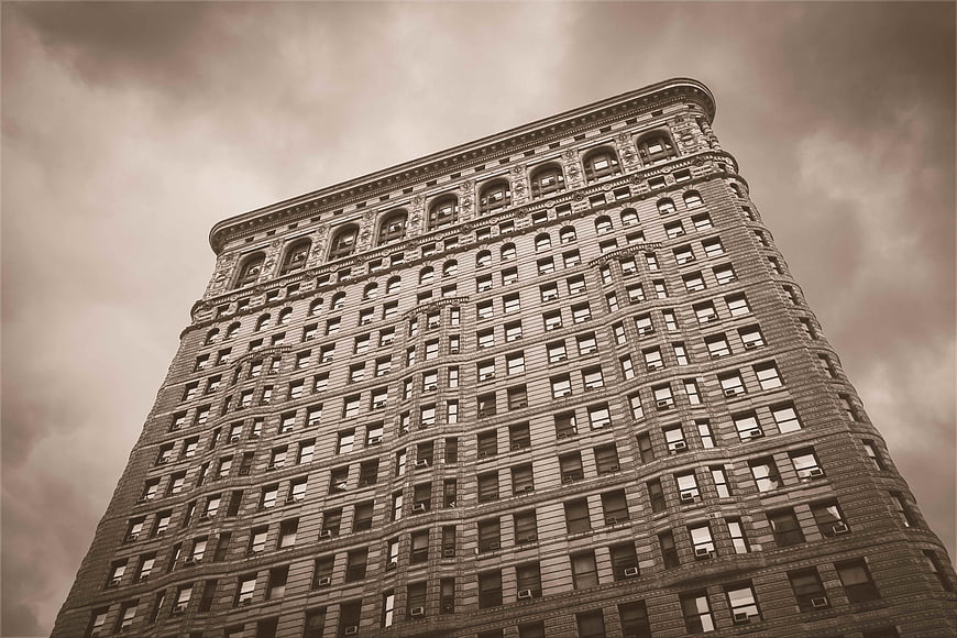 Low angle view of Flatiron Building in sepia tone