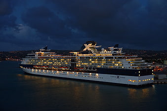 Celebrity Cruises Ship Docked At Night With Dramatic Cloudy Sky