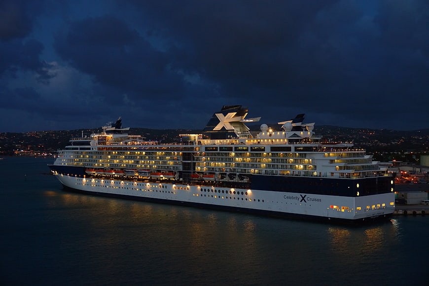 Celebrity Cruises Ship Docked At Night With Dramatic Cloudy Sky