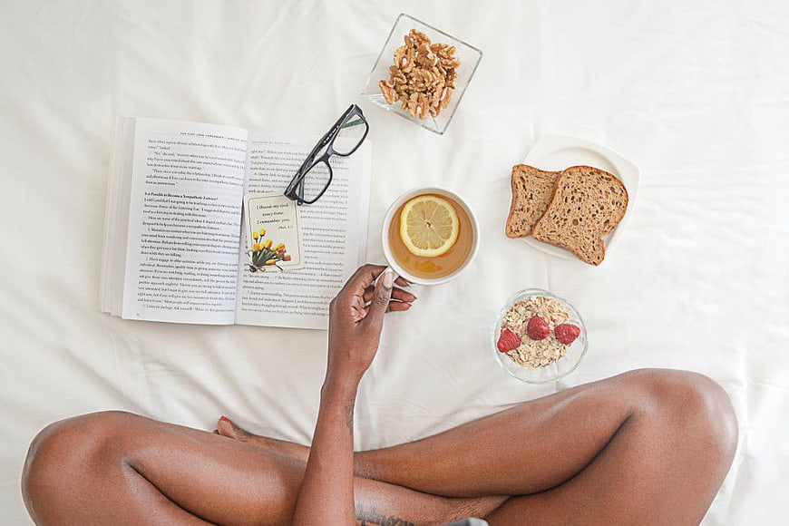 Top View Black Woman Breakfast in Bed with Book