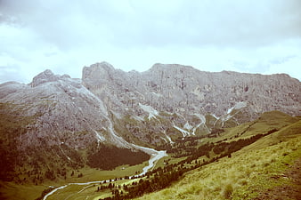 Majestic Alpine Mountain Landscape with Green Valley and Rocky Peaks
