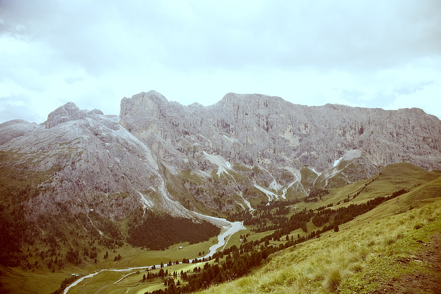 Majestic Alpine Mountain Landscape with Green Valley and Rocky Peaks