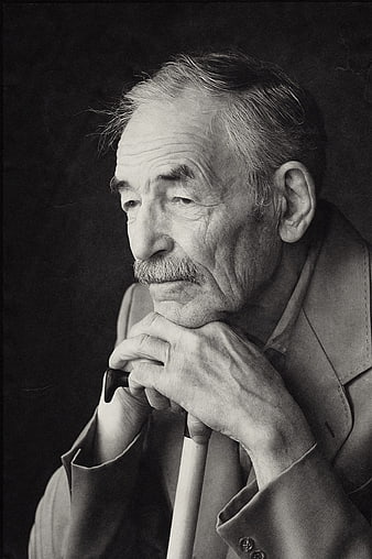 Black and white portrait of elderly man with cane