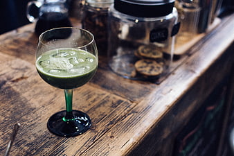 Green Matcha Cocktail in Glass on Wooden Bar