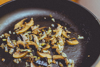 Sautéed Mushrooms and Onions Cooking in a Pan