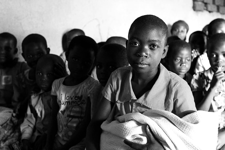 Black and white portrait of African children in a classroom