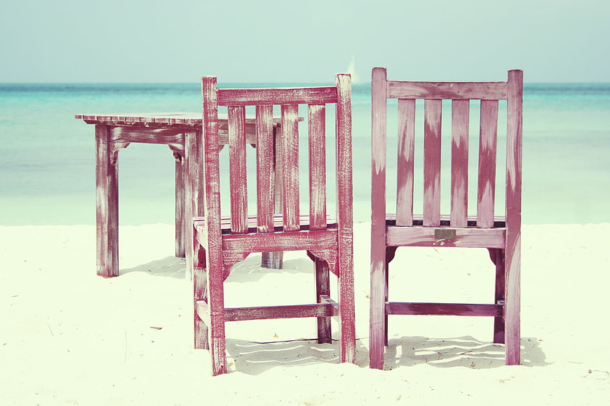 Vintage Wooden Chairs and Table on Tropical White Sand Beach