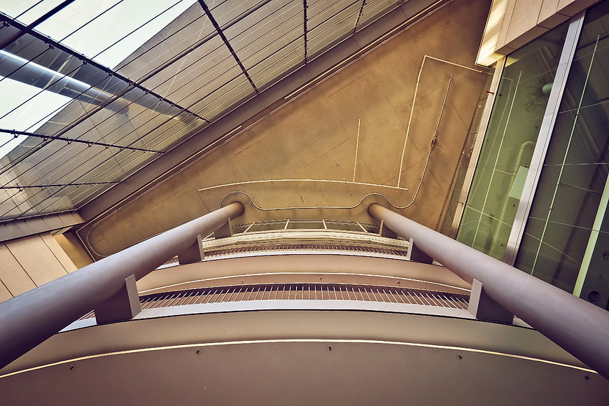 Low angle view of modern concrete architecture with curved lines