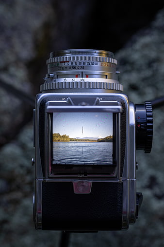 Vintage Hasselblad Camera Reflecting Lake Landscape