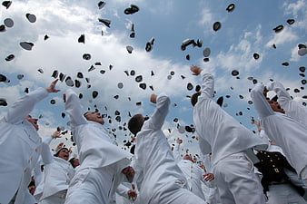 Naval Academy Graduates Throwing Hats in Celebration