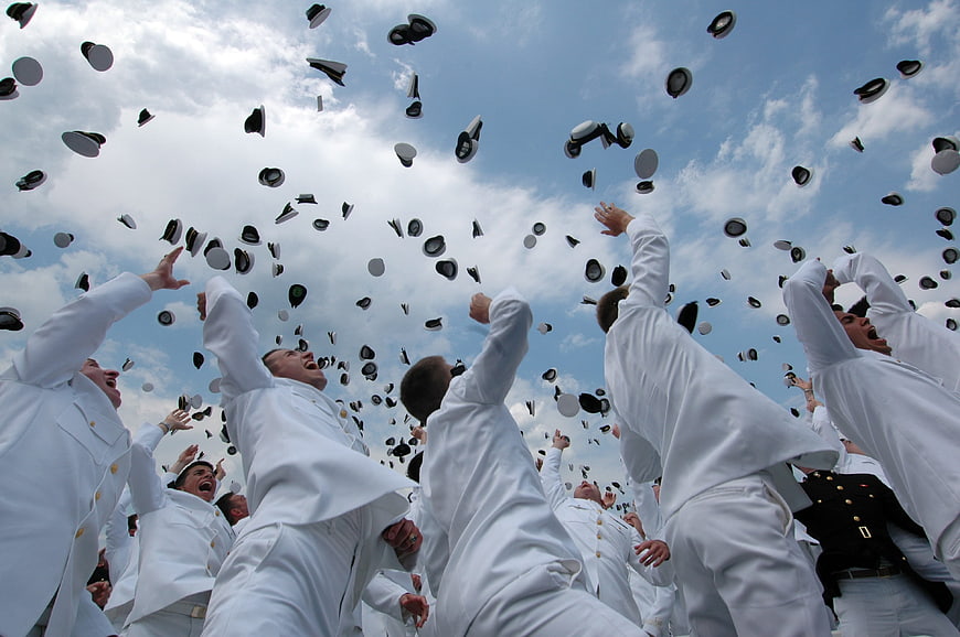 Naval Academy Graduates Throwing Hats in Celebration
