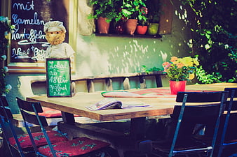 Cozy Outdoor Cafe Table with Teddy Bear Chef and Menu