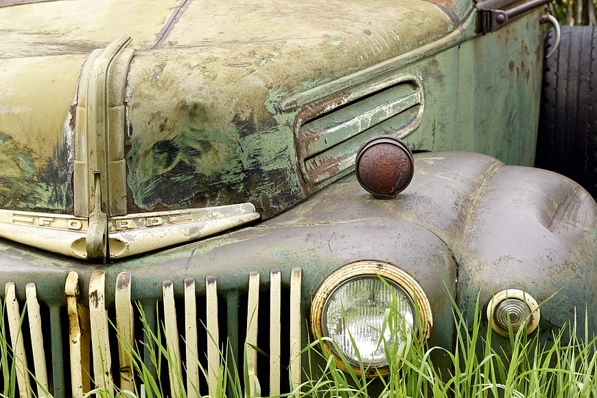 Close-up of Rusted Vintage Ford Truck Front Grille