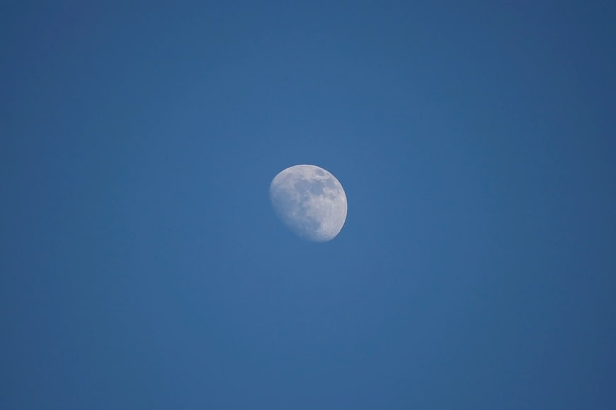 White Moon in Blue Sky