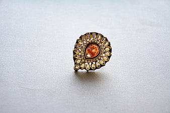 Gold Earring With Orange Gemstone And Crystal Details