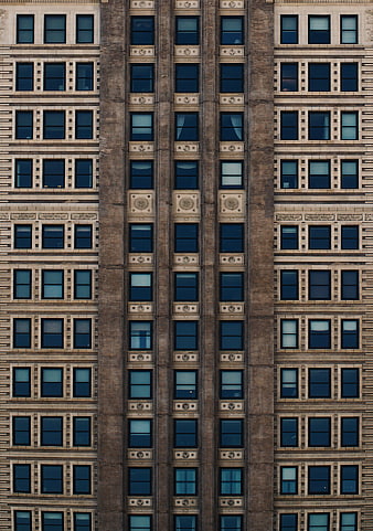 Symmetrical facade of a historic building with repeating windows