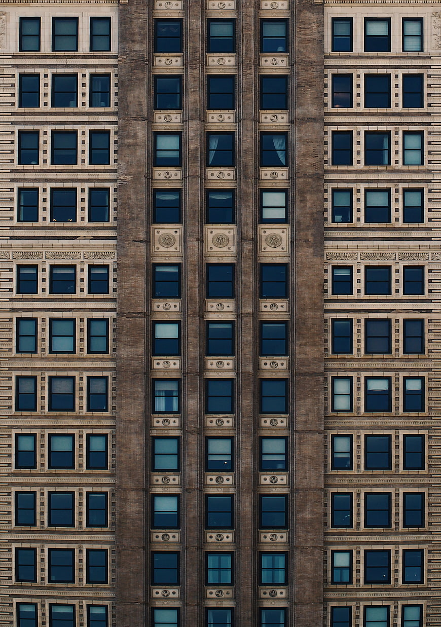 Symmetrical facade of a historic building with repeating windows