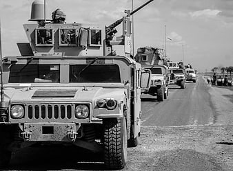 Black and White Military Humvee Convoy on Desert Road