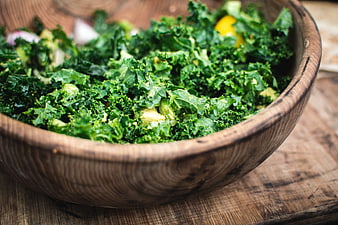 Fresh Kale Salad in Rustic Wooden Bowl