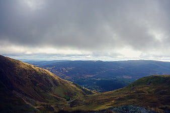 Dramatic Highland Mountain Landscape with Cloudy Sky