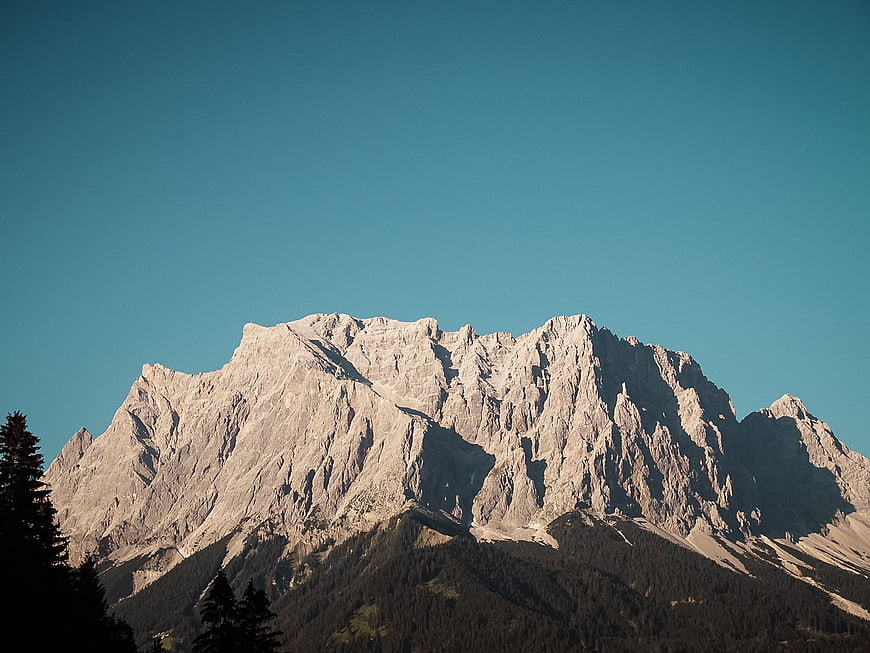 Majestic Rocky Mountain Peak Against Clear Blue Sky