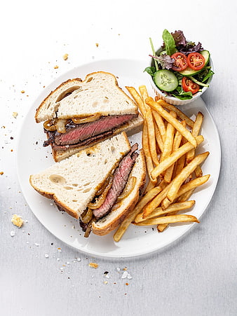 Roast Beef Sandwich with Fries and Salad on White Plate