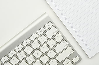 Minimalist Keyboard and Checklist Notebook Flat Lay