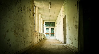 Abandoned Dilapidated Corridor with Peeling Paint and Decay
