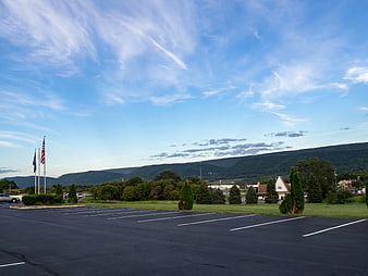 Empty Parking Lot with Mountain View and Blue Sky