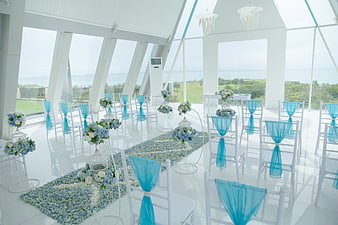 White and blue wedding chapel with ocean view