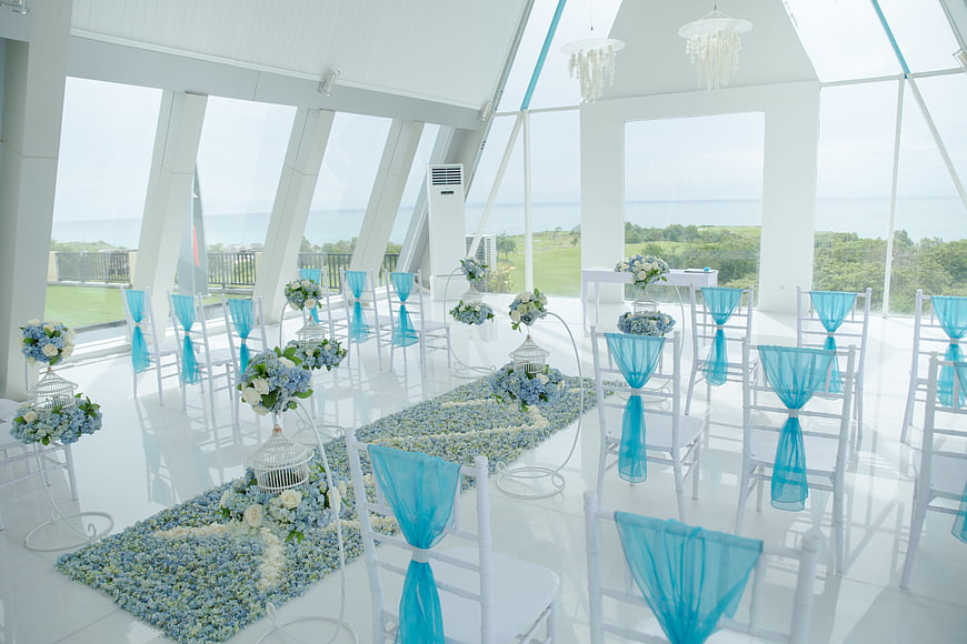 White and blue wedding chapel with ocean view
