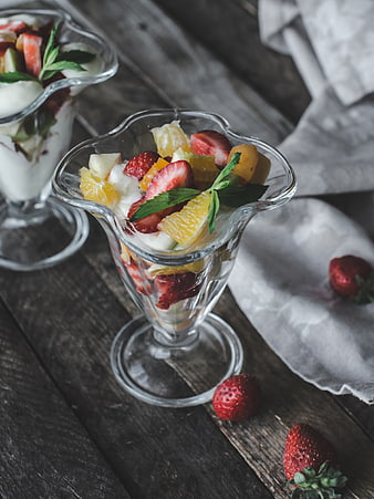 Fresh fruit parfait with strawberries and yogurt in glass