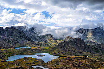 Majestic Mountain Landscape with Lakes and Clouds
