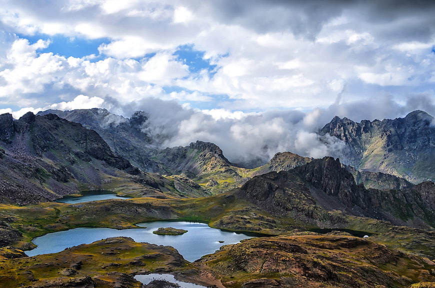 Majestic Mountain Landscape with Lakes and Clouds