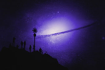 Silhouetted Hikers on Mountain Peak Under Milky Way