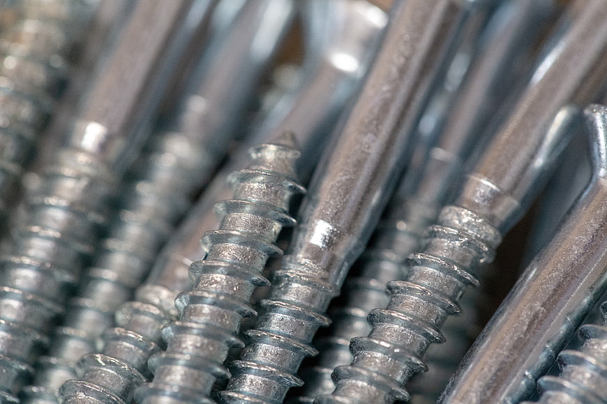 Close-up of shiny metal screws for construction and carpentry