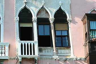 Venetian Gothic Architecture on Pink Building Facade