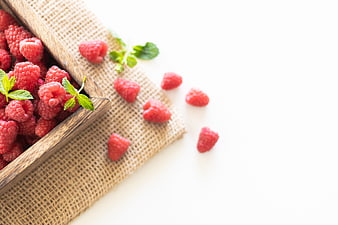 Fresh Raspberries in Wooden Bowl on Burlap with Mint