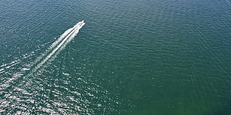 Aerial View of Speedboat Leaving White Wake on Blue Sea