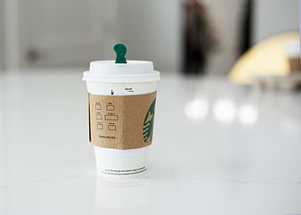 Starbucks Coffee Cup on White Marble Tabletop